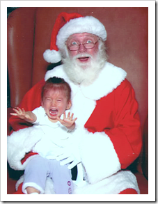 Screaming girl in Santa's lap